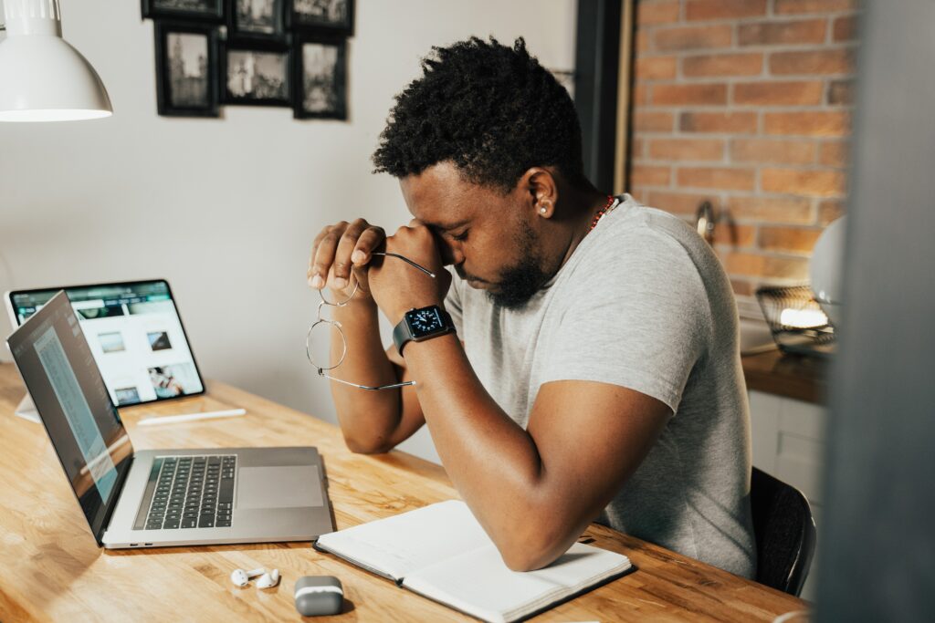 person with headache to show remote working risks